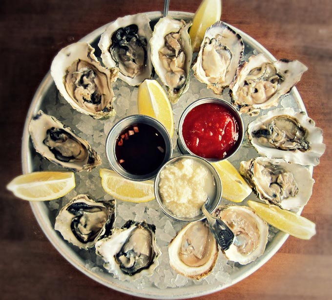 dozen oysters on the half shell platter
