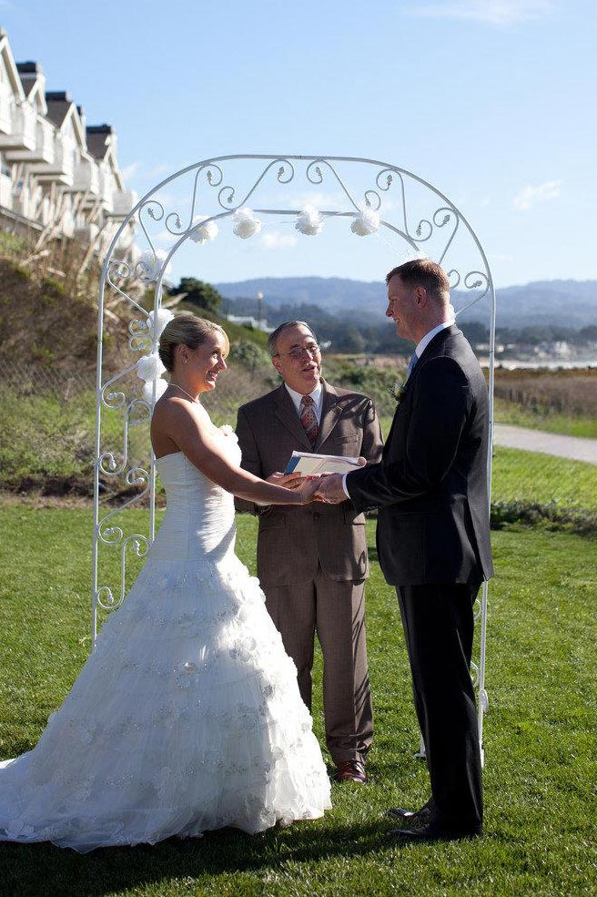 bride and groom saying their wedding vows on Sam's oceanfront lawn