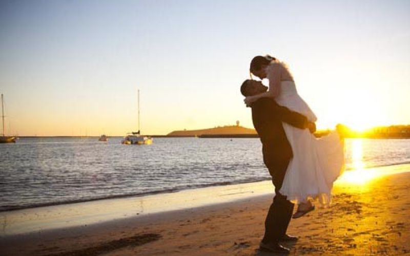 wedding couple celebrating marriage on the beach